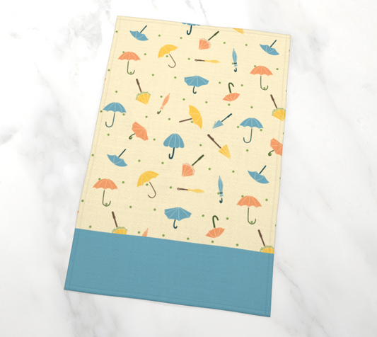 Umbrella Parade Tea Towel in Cream